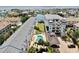 Aerial shot of condos with waterfront views, a community pool, and landscaping at 443 Pinellas Bayway S # 105, Tierra Verde, FL 33715