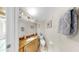 Well-lit bathroom featuring a granite countertop vanity, neutral walls, and tile flooring at 443 Pinellas Bayway S # 105, Tierra Verde, FL 33715