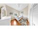 Cozy bedroom with hardwood floors, vaulted ceiling, and a single bed with white furnishings at 443 Pinellas Bayway S # 105, Tierra Verde, FL 33715