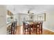 Bright dining room featuring a large dining table and French doors at 443 Pinellas Bayway S # 105, Tierra Verde, FL 33715