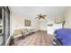 Comfortable enclosed porch with tiled floor, ceiling fan, and laundry at 443 Pinellas Bayway S # 105, Tierra Verde, FL 33715