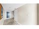 Neutral hallway featuring tile flooring with decorative design and white doors at 443 Pinellas Bayway S # 105, Tierra Verde, FL 33715