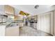 Updated eat-in kitchen with stainless appliances, granite counters, and ample storage at 443 Pinellas Bayway S # 105, Tierra Verde, FL 33715