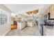 Updated kitchen with granite counters, stainless appliances, and convenient breakfast bar area at 443 Pinellas Bayway S # 105, Tierra Verde, FL 33715