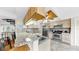 Renovated kitchen with stainless steel appliances, granite countertops, and breakfast bar at 443 Pinellas Bayway S # 105, Tierra Verde, FL 33715