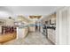 Spacious eat-in kitchen with stainless appliances, tile floors and view into the dining area at 443 Pinellas Bayway S # 105, Tierra Verde, FL 33715