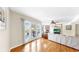 Spacious living room with hardwood floors, ceiling fan, and access to a patio through French doors at 443 Pinellas Bayway S # 105, Tierra Verde, FL 33715