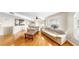 Bright living room featuring hardwood floors, a ceiling fan, and comfortable couches at 443 Pinellas Bayway S # 105, Tierra Verde, FL 33715