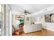 Bright living room with wood floors, natural light, and staircase access at 443 Pinellas Bayway S # 105, Tierra Verde, FL 33715
