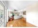 Spacious living room with wood floors and access to outdoor space at 443 Pinellas Bayway S # 105, Tierra Verde, FL 33715