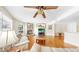 Spacious living room with a fireplace, wood floors, and comfortable seating at 443 Pinellas Bayway S # 105, Tierra Verde, FL 33715