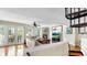 Cozy living room with hardwood floors, fireplace, and french doors to a balcony at 443 Pinellas Bayway S # 105, Tierra Verde, FL 33715