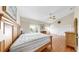 Large bedroom with wood floors, vaulted ceiling, and large windows for ample natural light at 443 Pinellas Bayway S # 105, Tierra Verde, FL 33715