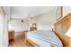 Spacious main bedroom featuring wood floors, ceiling fan, and multiple closets at 443 Pinellas Bayway S # 105, Tierra Verde, FL 33715