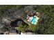 A high-angle view shows a community pool, pond and other neighborhood amenities at 764 Captiva Ne Ct, St Petersburg, FL 33702