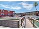 Waterfront lodging with multiple units and an outdoor dining area on a sunny day at 8565 W Gulf Blvd # 17S, Treasure Island, FL 33706