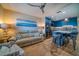 Cozy living room with modern kitchen, sleek cabinets, and stylish island seating at 8565 W Gulf Blvd # 17S, Treasure Island, FL 33706
