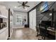 Well-lit bedroom featuring modern decor, a stylish desk, and ample space for work or relaxation at 14214 Quintessa Ln, Lithia, FL 33547