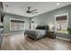 Spacious bedroom featuring a ceiling fan, plenty of natural light, and a relaxing, serene atmosphere at 14214 Quintessa Ln, Lithia, FL 33547