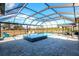 Resort style pool featuring spa, covered patio with an outdoor dining area, and a beautiful backyard at 14214 Quintessa Ln, Lithia, FL 33547
