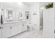 Modern bathroom featuring double sinks, glass shower, and marble tile at 644 3Rd S Ave # 305, St Petersburg, FL 33701
