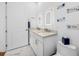 Bathroom featuring double sinks, marble tile, and decorative art at 644 3Rd S Ave # 305, St Petersburg, FL 33701
