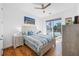 Sunny bedroom with hardwood floors, a ceiling fan, and a calming color palette at 644 3Rd S Ave # 305, St Petersburg, FL 33701