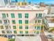 Close up view of the condos exterior showing multiple balconies with green windows at 644 3Rd S Ave # 305, St Petersburg, FL 33701