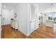 Inviting hallway featuring light hardwood flooring and views of the kitchen area at 644 3Rd S Ave # 305, St Petersburg, FL 33701