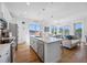 Spacious kitchen island overlooking a bright open living area with hardwood floors at 644 3Rd S Ave # 305, St Petersburg, FL 33701