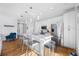 Bright, open kitchen with stainless steel appliances, white cabinets, and a large quartz island at 644 3Rd S Ave # 305, St Petersburg, FL 33701