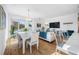 Bright living area with a patio view, modern furniture, and gleaming hardwood floors at 644 3Rd S Ave # 305, St Petersburg, FL 33701