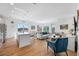 Open-concept living space with modern furnishings, hardwood floors, and abundant natural light at 644 3Rd S Ave # 305, St Petersburg, FL 33701