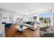 Bright open concept living space with hardwood floors, neutral furniture, and lots of natural light at 644 3Rd S Ave # 305, St Petersburg, FL 33701