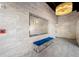 Modern lobby with tiled flooring, blue bench seating and elegant chandelier lighting at 644 3Rd S Ave # 305, St Petersburg, FL 33701