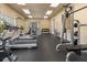 Well-equipped gym features treadmills, weight machines and bench with weights at 711 Old Windsor Way, Spring Hill, FL 34609