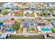Aerial view of a waterfront property featuring outdoor entertaining space at 8722 Elmwood Ln, Tampa, FL 33615
