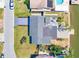 An aerial view of the home showcasing its updated roof, patio area, and waterfront access at 8722 Elmwood Ln, Tampa, FL 33615