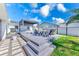Expansive backyard with a large patio, pergola, hot tub, outdoor kitchen, and dining area for outdoor enjoyment at 8722 Elmwood Ln, Tampa, FL 33615