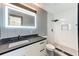 Updated bathroom with a sleek vanity, shower and modern fixtures at 8722 Elmwood Ln, Tampa, FL 33615