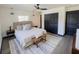 Bright bedroom with neutral colors, ceiling fan, and accent rug at 8722 Elmwood Ln, Tampa, FL 33615
