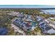 Aerial view of townhomes by lake with community pool and parking at 12189 Armenia Gables Cir # 12189, Tampa, FL 33612