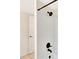 Updated bathroom featuring tiled walls, a modern shower head, and brushed metal fixtures at 12189 Armenia Gables Cir # 12189, Tampa, FL 33612