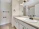 Well-lit bathroom with a large mirror, ample counter space, and brushed metal fixtures at 12189 Armenia Gables Cir # 12189, Tampa, FL 33612