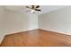 Spacious bedroom with hardwood floors, a ceiling fan, and base molding at 12189 Armenia Gables Cir # 12189, Tampa, FL 33612