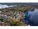 This aerial view captures the lakefront homes and their prime position in a serene community at 1903 Haven Bend, Tampa, FL 33613
