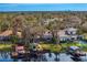 An aerial view of this lakefront home showcases its amazing views and private dock at 1903 Haven Bend, Tampa, FL 33613