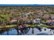 An aerial view of this gorgeous lakefront property with lush trees and amazing water access at 1903 Haven Bend, Tampa, FL 33613
