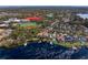 Stunning aerial view of a lakefront home with boat docks near Carrollwood Day School, offering serene waterfront living at 1903 Haven Bend, Tampa, FL 33613