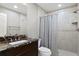 Bathroom features a marble countertop vanity and walk-in shower with tiled walls at 1903 Haven Bend, Tampa, FL 33613